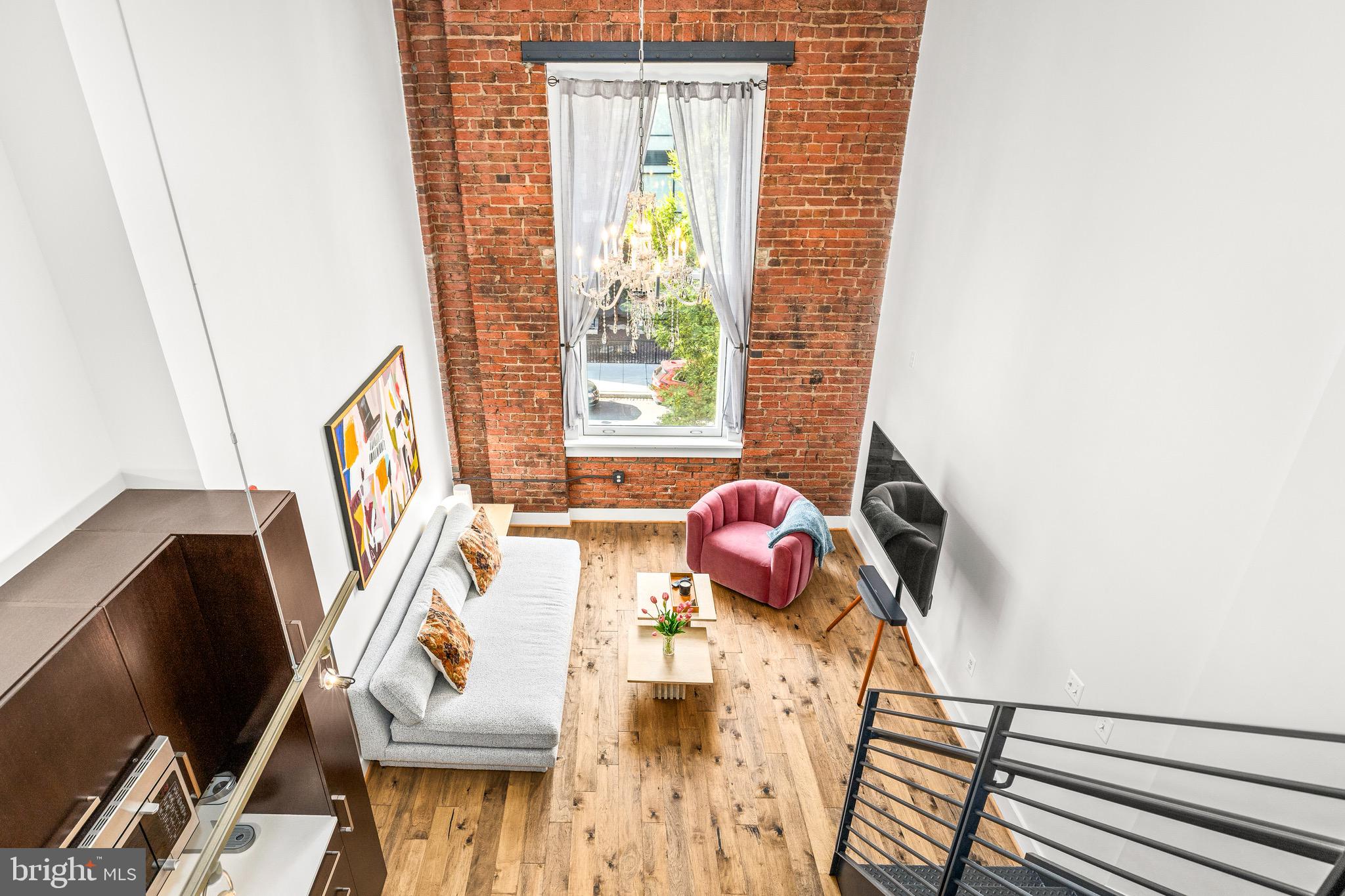 1401 R Street Northwest, Unit 206 Washington, DC 20009 - Photo 11 of 23 a living room with furniture and a window