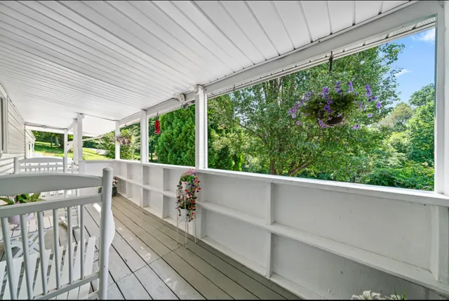a view of balcony with furniture