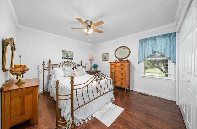 a bedroom with furniture and a window