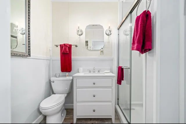 a bedroom with furniture and a chandelier