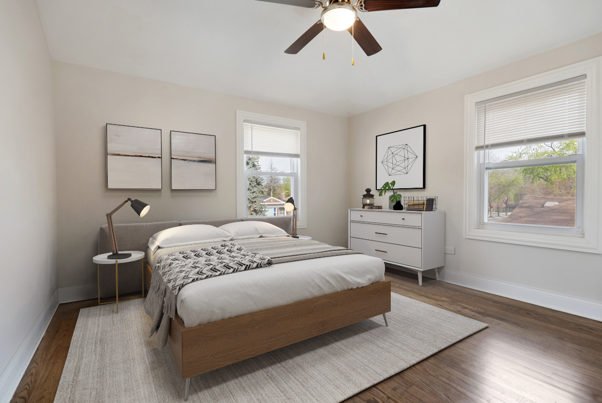 12511 South State Street Chicago, IL 60628 - Photo 18 of 26 a bedroom with a large bed and a window