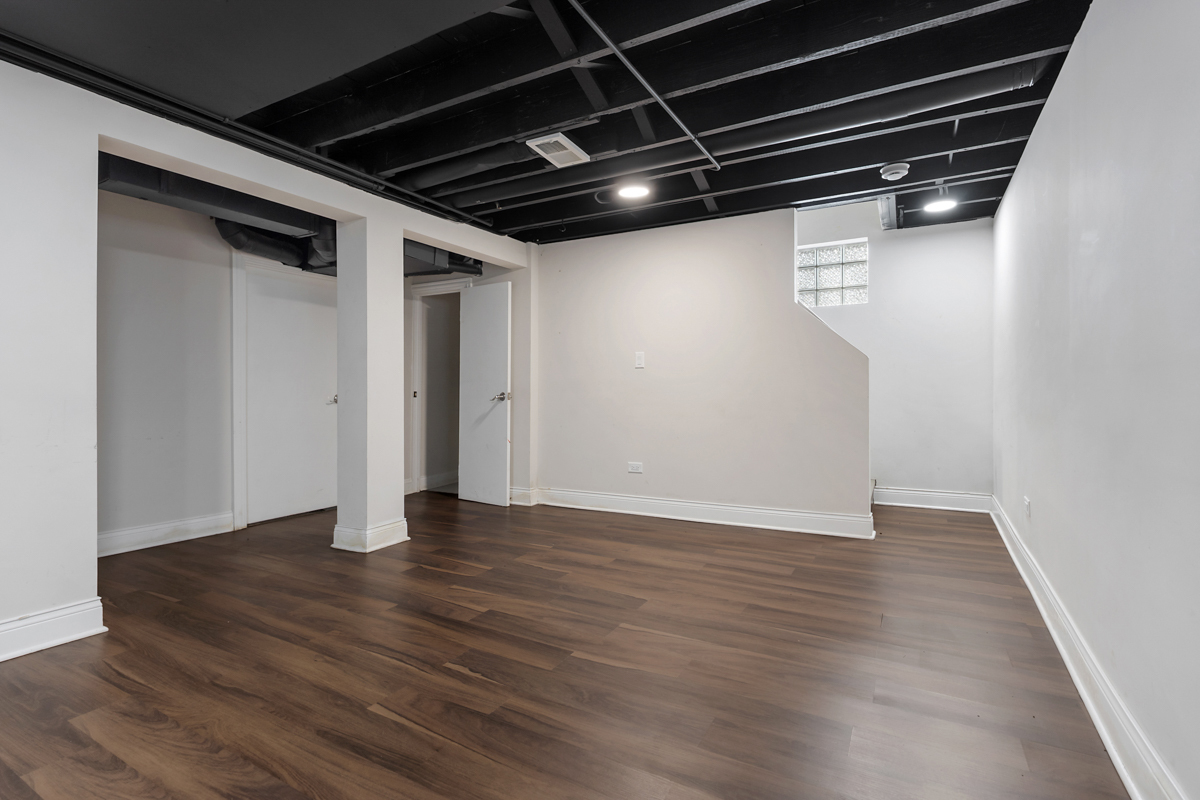 12511 South State Street Chicago, IL 60628 - Photo 20 of 26 a view of an empty room with wooden floor