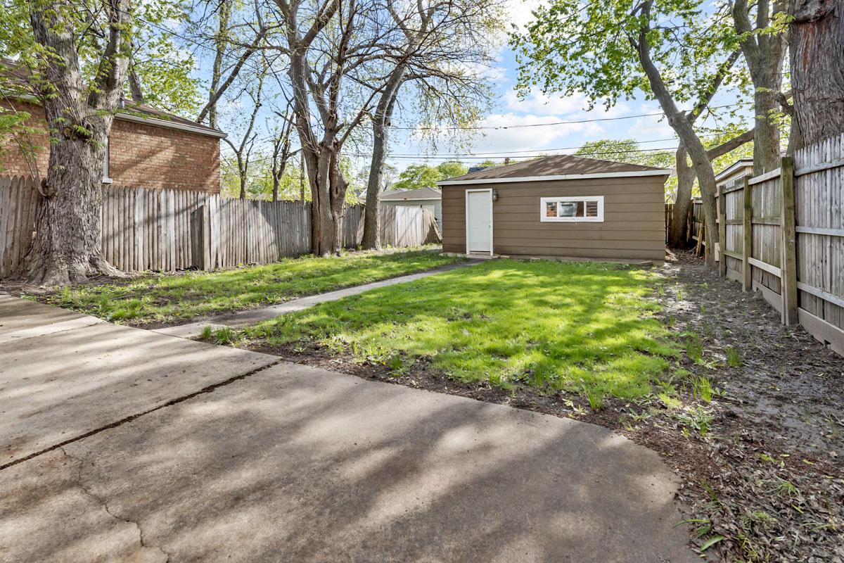 12511 South State Street Chicago, IL 60628 - Photo 24 of 26 a view of a house with a yard