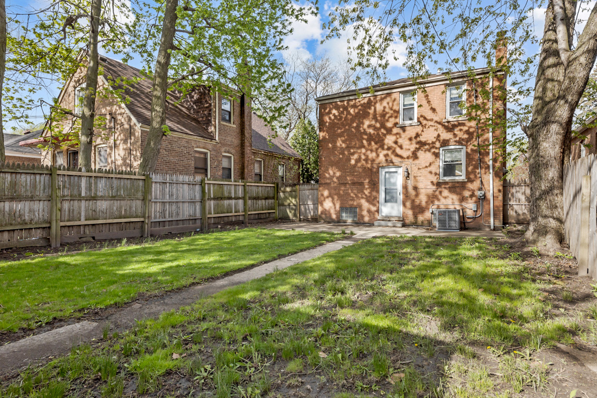 12511 South State Street Chicago, IL 60628 - Photo 25 of 26 a view of a yard with a large tree
