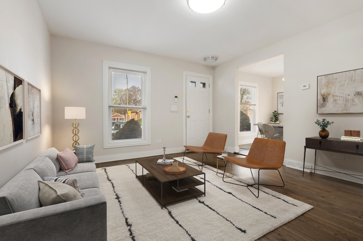 12511 South State Street Chicago, IL 60628 - Photo 3 of 26 a living room with furniture and a window