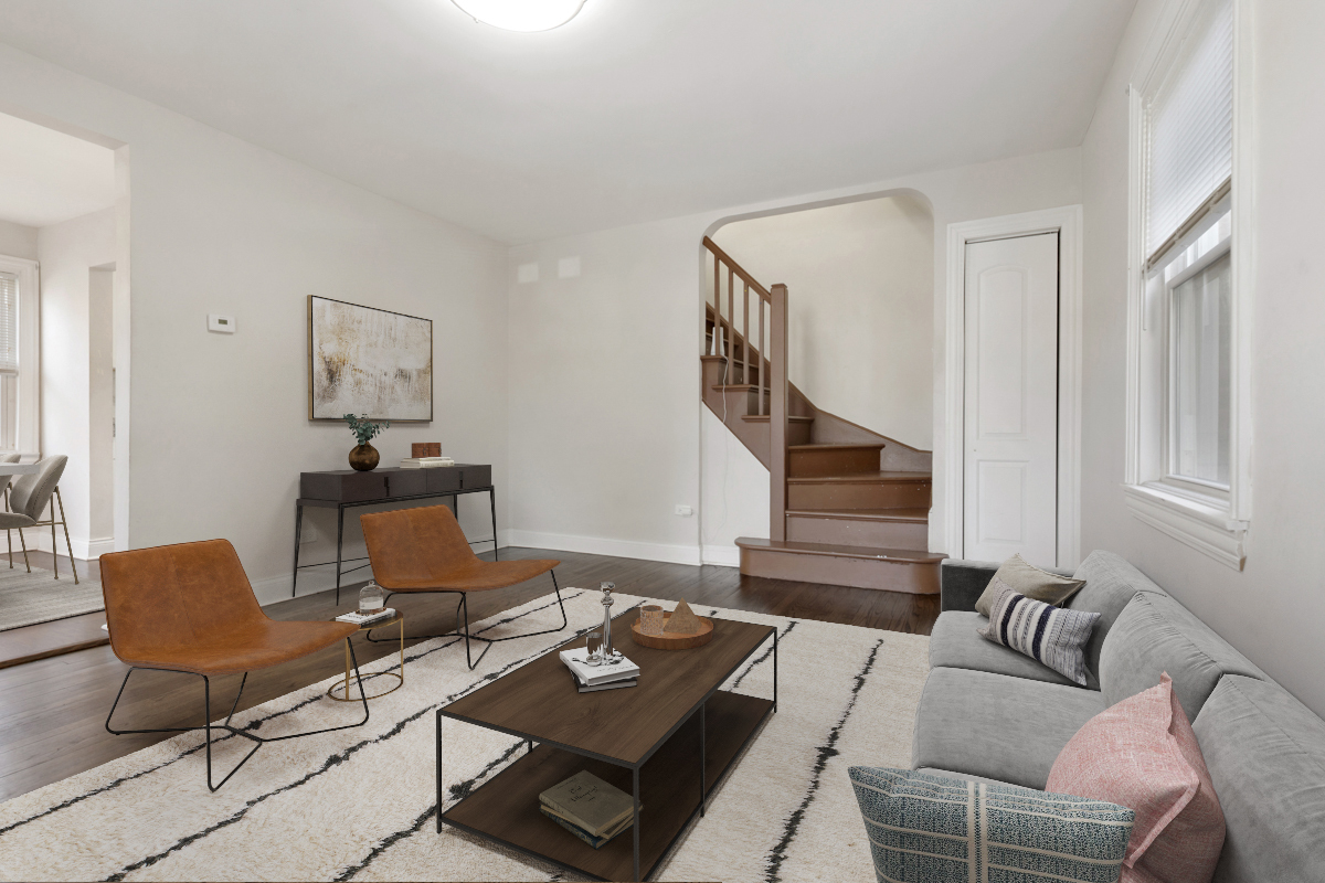 12511 South State Street Chicago, IL 60628 - Photo 5 of 26 a living room with furniture and a wooden floor