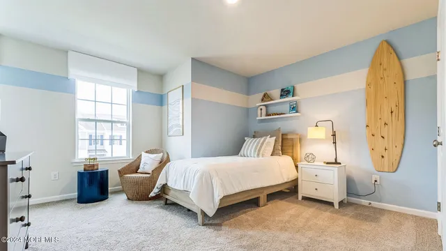 a bedroom with bed and window