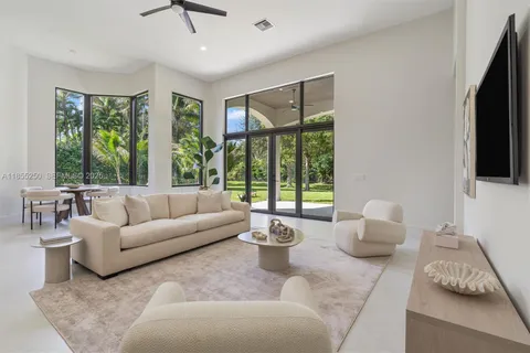 a kitchen with white cabinets and appliances
