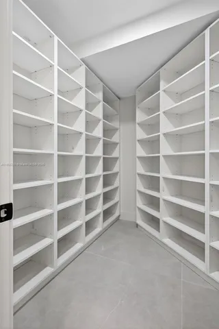 a bathroom with a granite countertop shower a toilet and sink