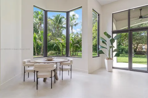a view of a livingroom with a ceiling fan and window