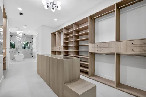 a living room with patio furniture and garden