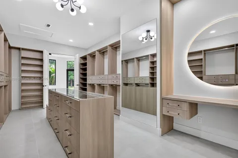 a view of a kitchen with a sink and dishwasher with a yard