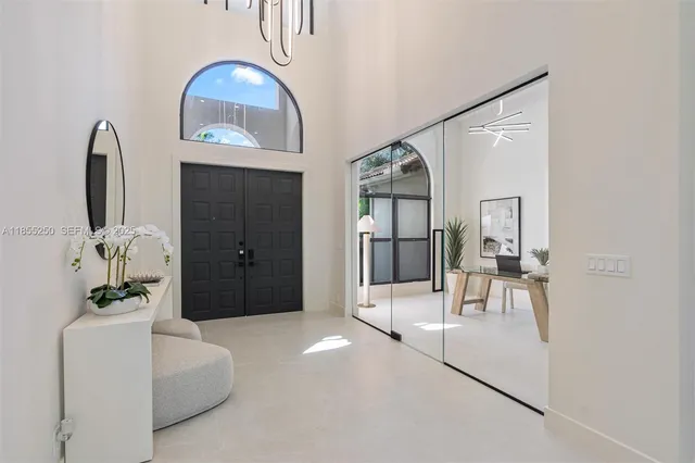 a kitchen with kitchen island a sink and a large window