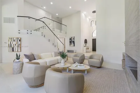 a work room with furniture and a flat screen tv