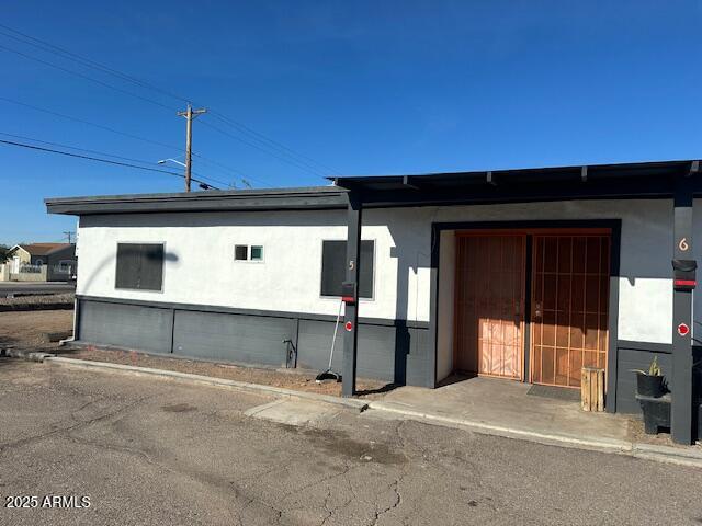 4301 South 7th Avenue, Unit 5 Phoenix, AZ 85041 - Photo 7 of 7 a front view of a house with a garage