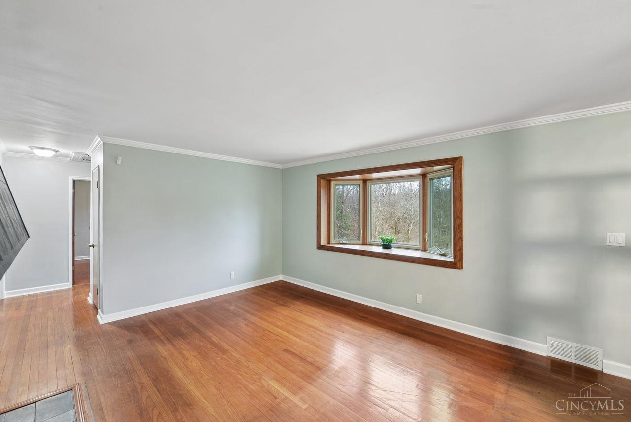 5258 Shepherd Road Cincinnati, OH 45223 - Photo 21 of 43 Here is the Living Room view without the virtual staging that shows the Bay Window and Gleaming Wood Floors.