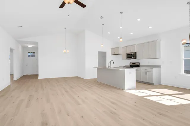 a view of kitchen with wooden floor