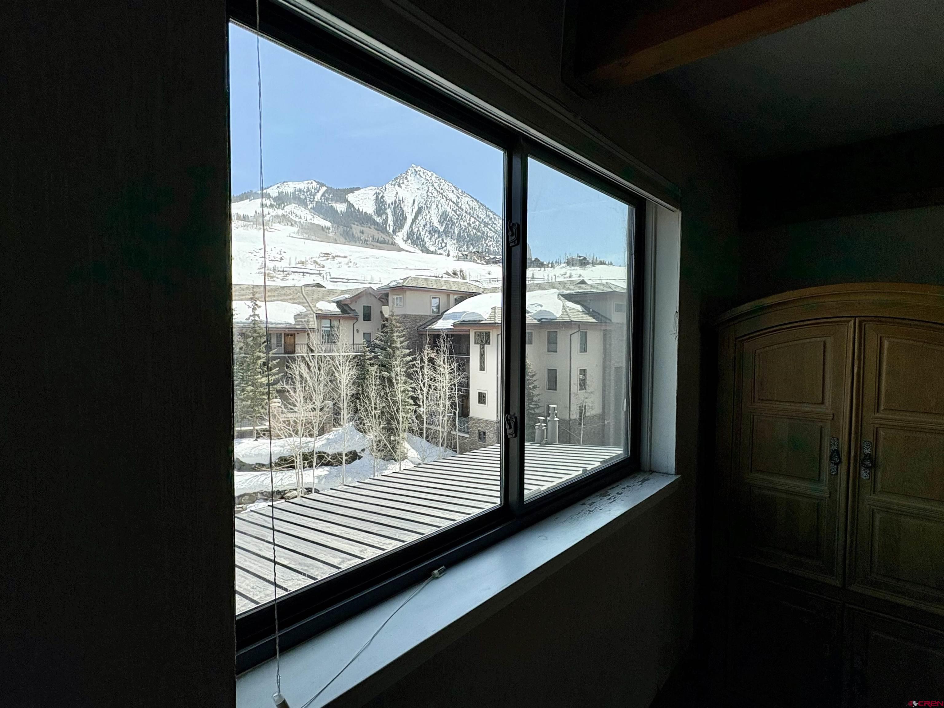 11 Hunter Hill Road, Unit 506 Crested Butte, CO 81225 - Photo 22 of 35 a view of a room with wooden floor and door