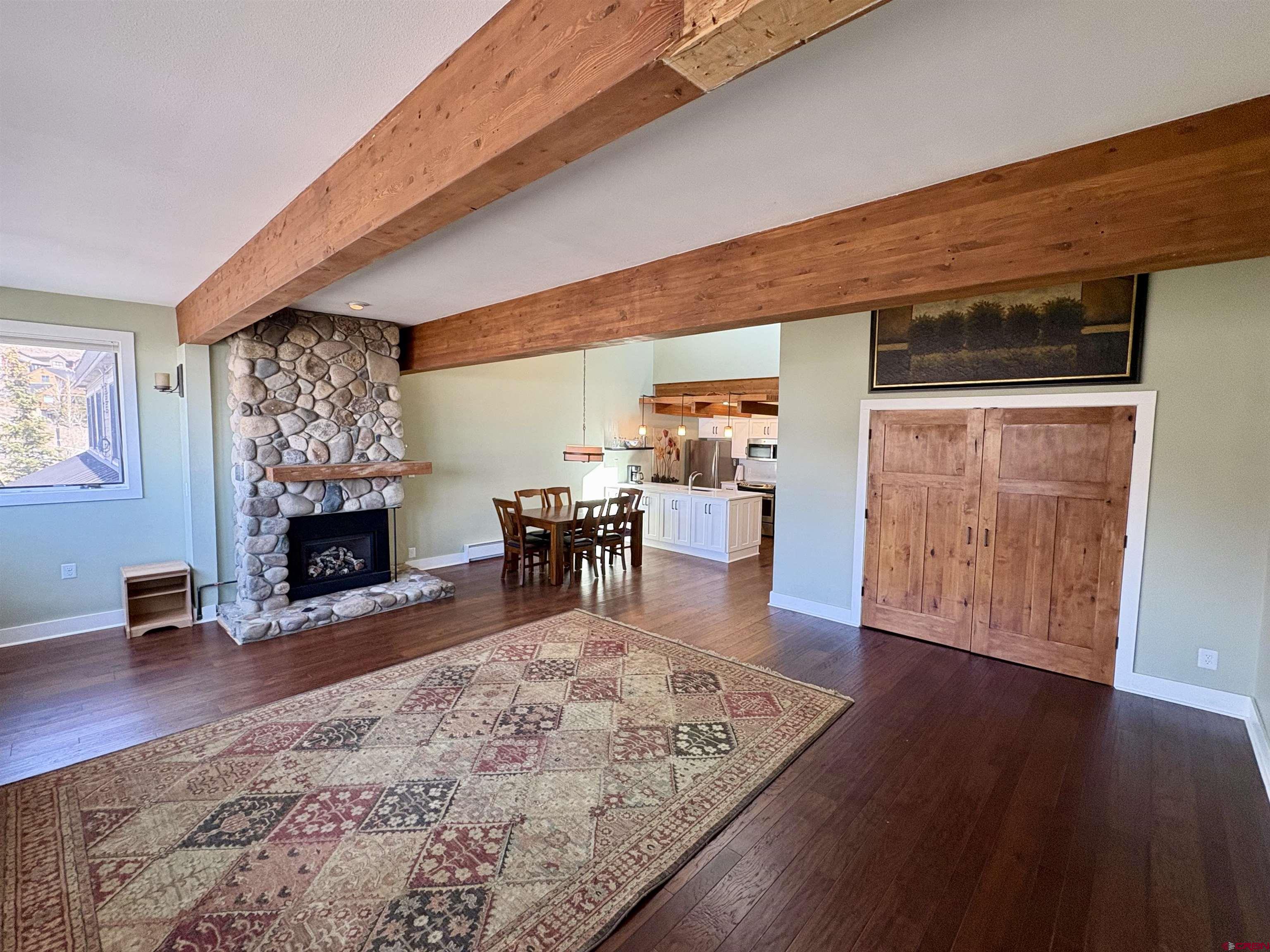 11 Hunter Hill Road, Unit 506 Crested Butte, CO 81225 - Photo 7 of 35 a view of a livingroom with furniture and a fireplace
