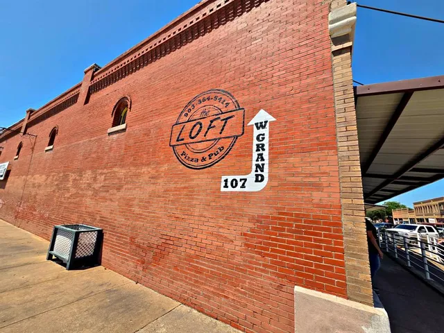 a brick building with a street sign on it