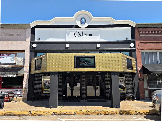 a view of a store with parking area