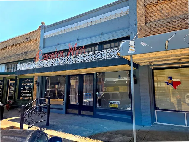 a view of a building with sitting area