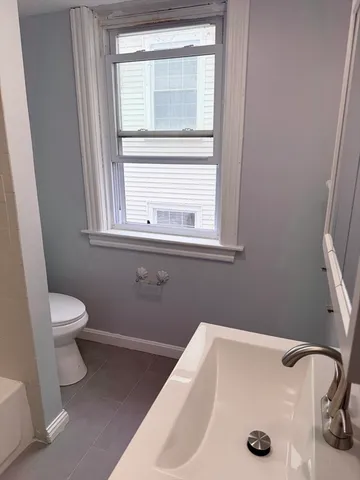 a bathroom with a sink and a toilet