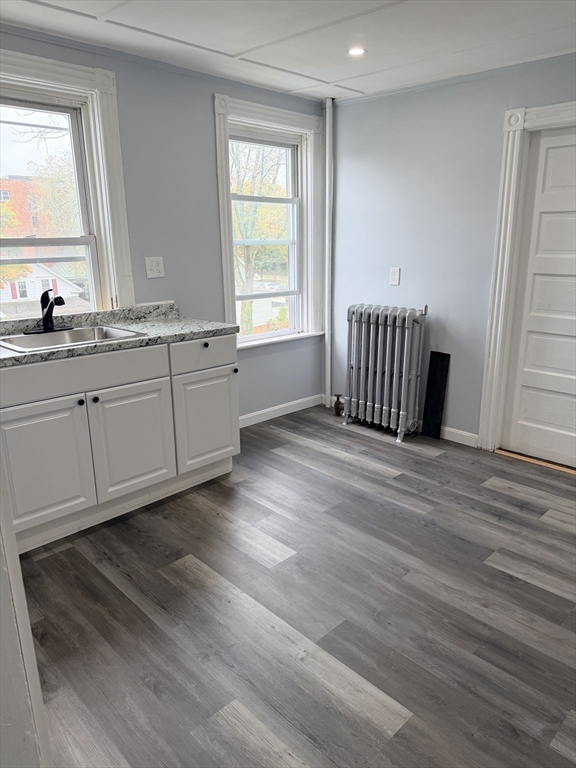 15 Mechanic Street, Unit 2 Attleboro, MA 02703 - Photo 2 of 15 a view of a kitchen with wooden floor and a window