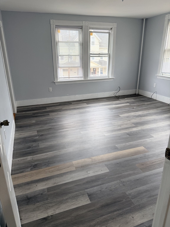 15 Mechanic Street, Unit 2 Attleboro, MA 02703 - Photo 5 of 15 a view of empty room with wooden floor and fan