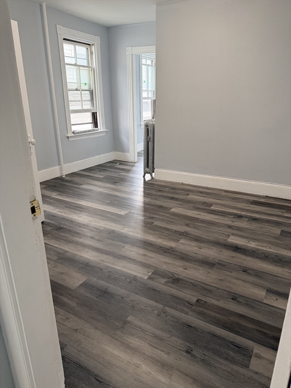 15 Mechanic Street, Unit 2 Attleboro, MA 02703 - Photo 6 of 15 wooden floor in an empty room with a window