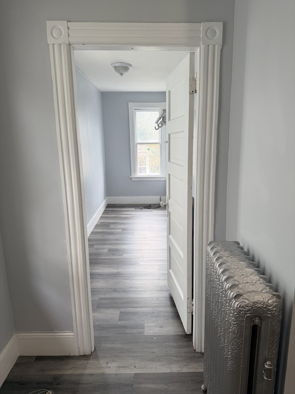 15 Mechanic Street, Unit 2 Attleboro, MA 02703 - Photo 8 of 15 a view of empty room with wooden floor