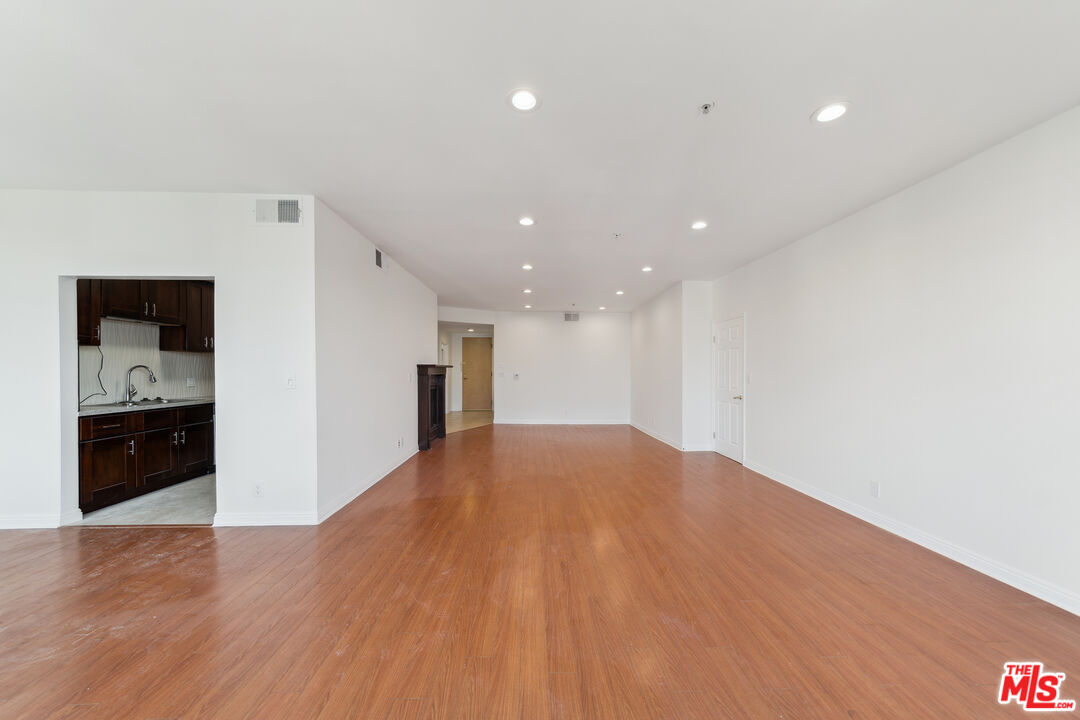 1508 Greenfield Avenue, Unit 307 Los Angeles, CA 90025 - Photo 12 of 27 a view of an empty room with wooden floor