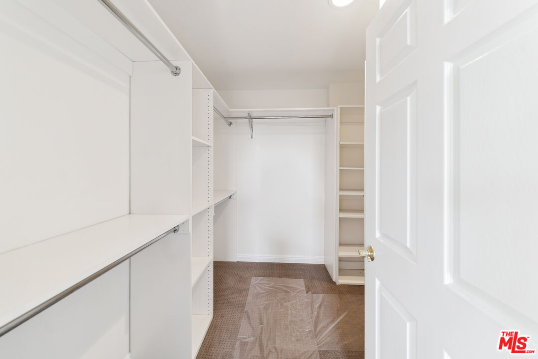 1508 Greenfield Avenue, Unit 307 Los Angeles, CA 90025 - Photo 15 of 27 a view of walk in closet with empty racks