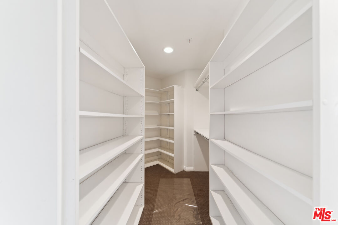 1508 Greenfield Avenue, Unit 307 Los Angeles, CA 90025 - Photo 16 of 27 a view of walk in closet with empty racks
