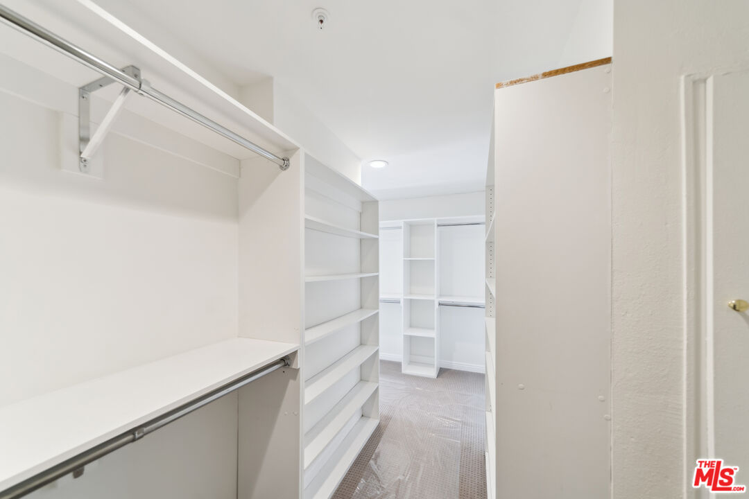 1508 Greenfield Avenue, Unit 307 Los Angeles, CA 90025 - Photo 17 of 27 a view of walk in closet with empty racks