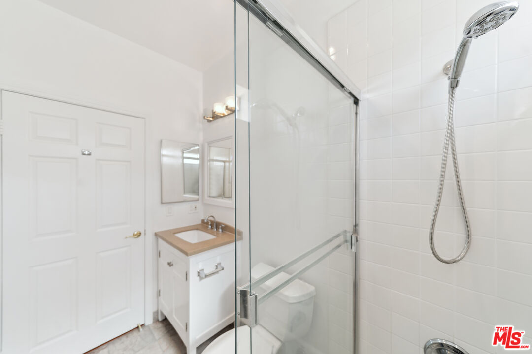 1508 Greenfield Avenue, Unit 307 Los Angeles, CA 90025 - Photo 24 of 27 a bathroom with a shower