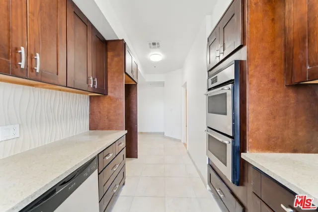 a view of kitchen with cabinets and wooden floor