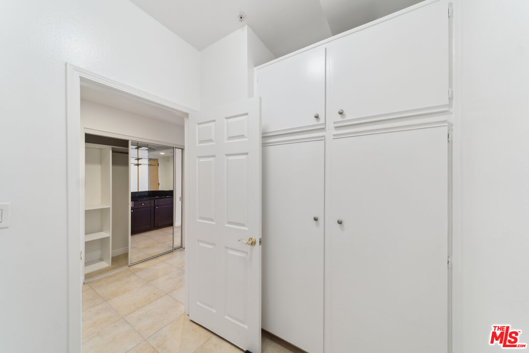 1508 Greenfield Avenue, Unit 307 Los Angeles, CA 90025 - Photo 10 of 27 a view of a livingroom with wooden floor and cabinet