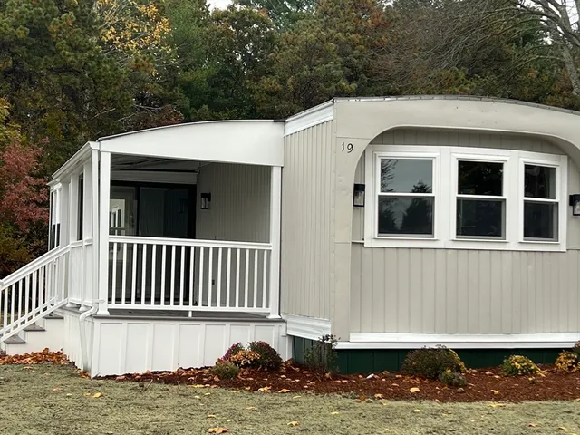 a view of a house with a small yard