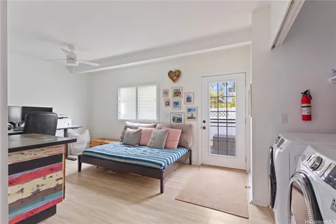 a bedroom with furniture and a rug