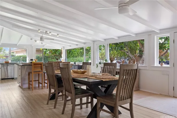 a view of a dining room with furniture window and outside view