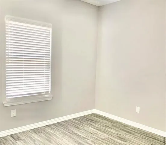 a view of a room that has a window in it