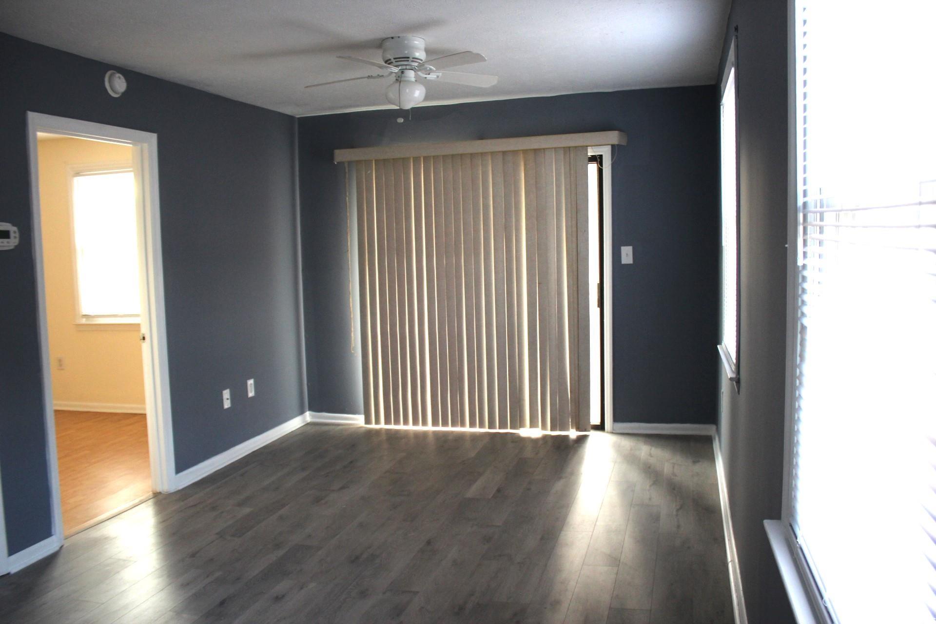 1500 Chester Street, Unit 2 Myrtle Beach, SC 29577 - Photo 2 of 9 Spare room with dark wood finished floors and a ceiling fan