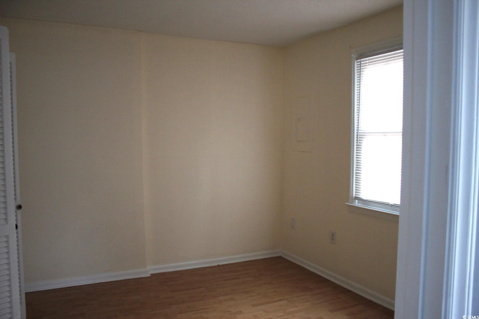 1500 Chester Street, Unit 2 Myrtle Beach, SC 29577 - Photo 7 of 9 Unfurnished room featuring light wood finished floors and baseboards