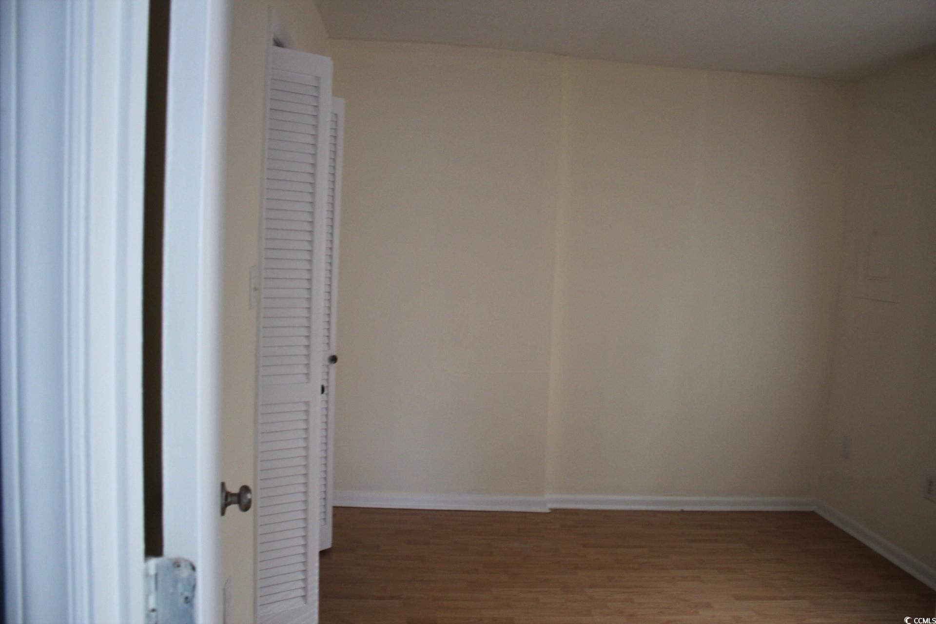 1500 Chester Street, Unit 2 Myrtle Beach, SC 29577 - Photo 9 of 9 Empty room featuring wood finished floors and baseboards
