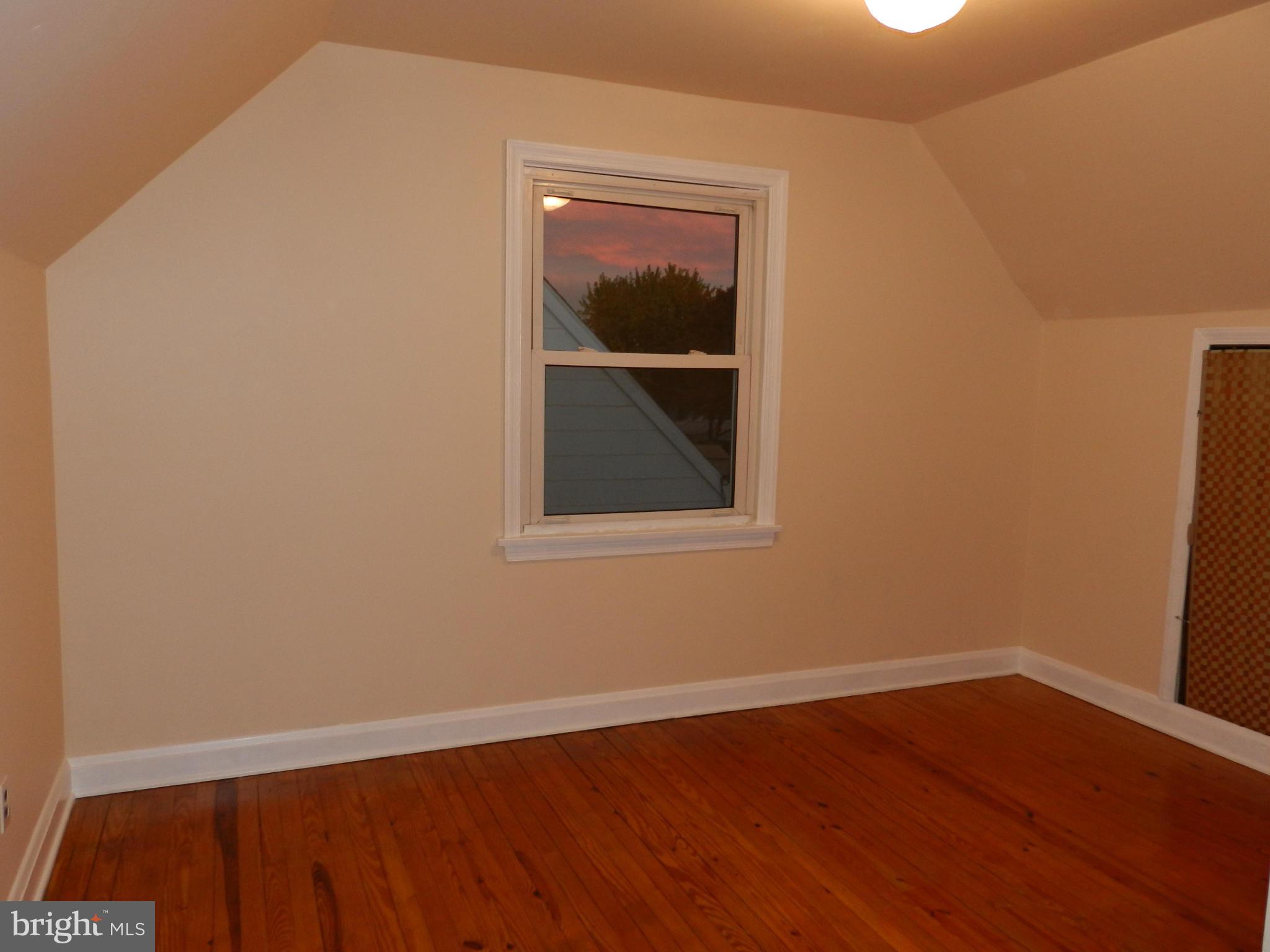 1502 Rita Road Dundalk, MD 21222 - Photo 15 of 21 a view of a small space with wooden floor and a window