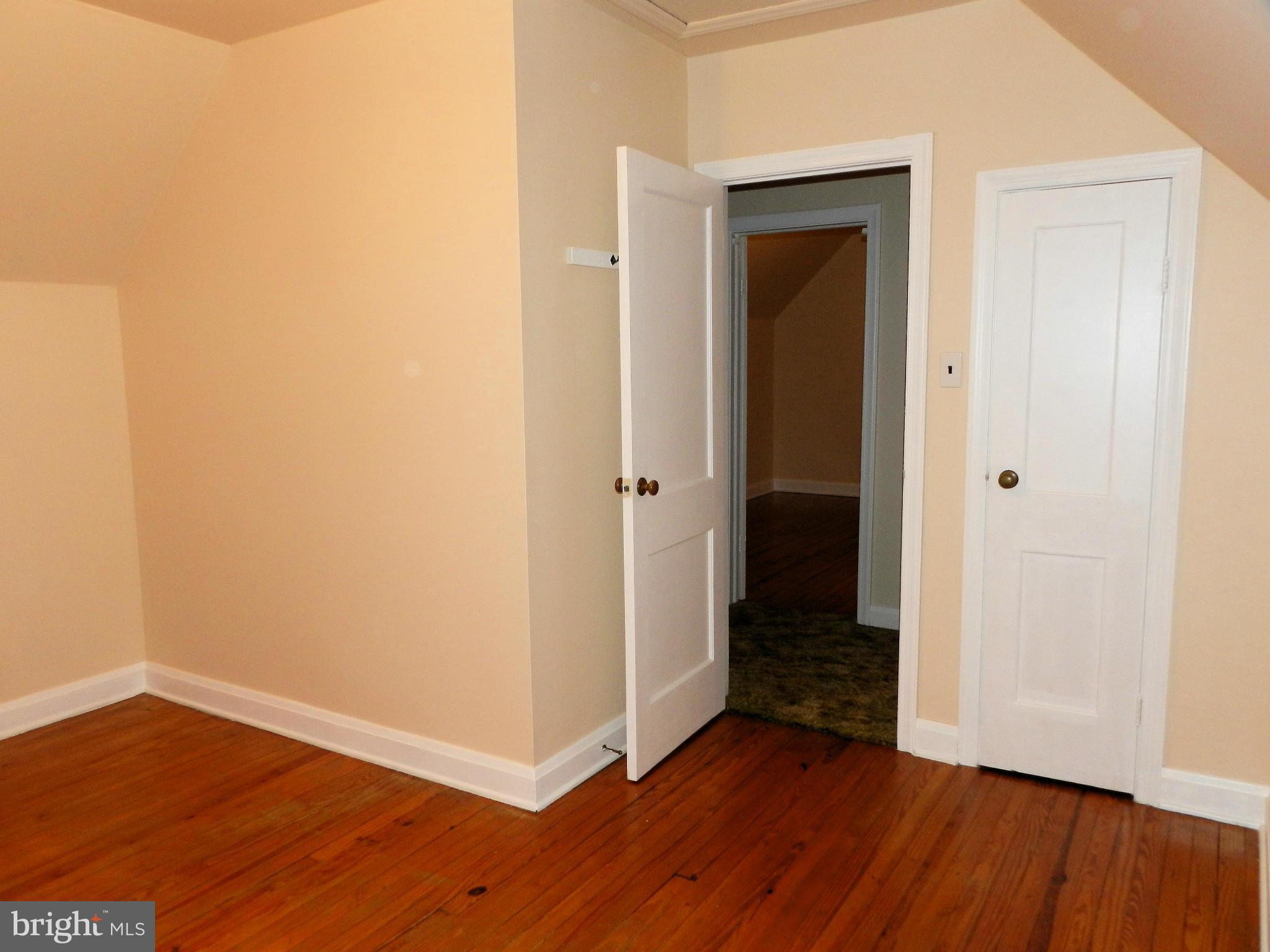 1502 Rita Road Dundalk, MD 21222 - Photo 18 of 21 an empty room with wooden floor and closet