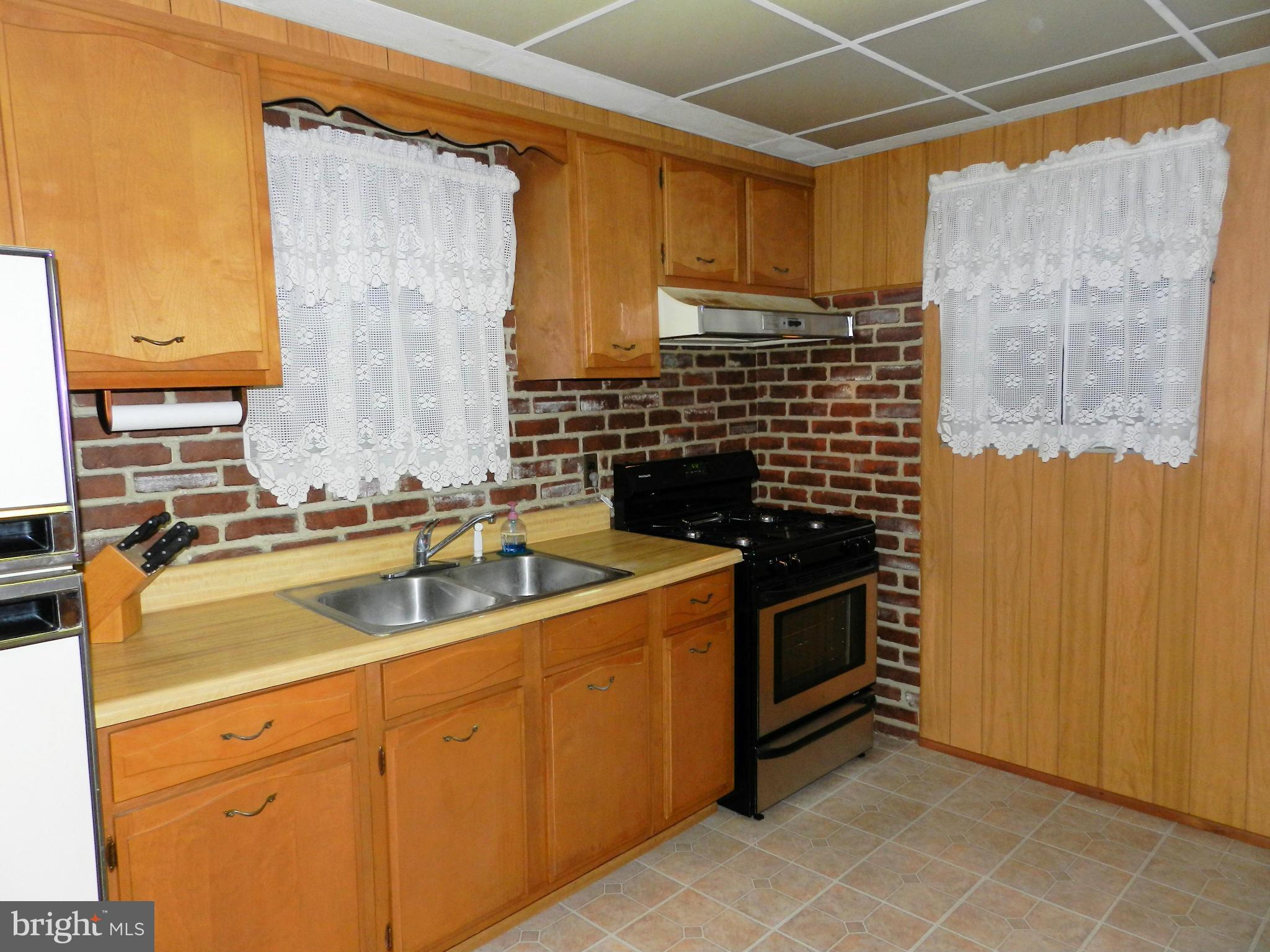 1502 Rita Road Dundalk, MD 21222 - Photo 6 of 21 a kitchen with a sink and cabinets