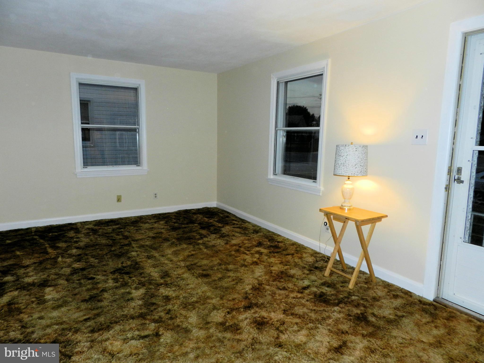 1502 Rita Road Dundalk, MD 21222 - Photo 8 of 21 a view of a livingroom with a table and chair
