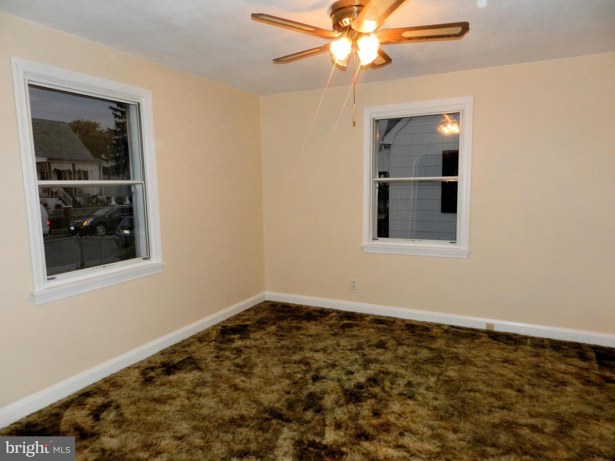1502 Rita Road Dundalk, MD 21222 - Photo 9 of 21 an empty room with a window and a chandelier fan